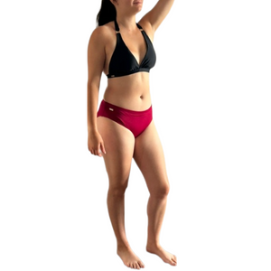 transgender woman wearing a tucking bikini bottom magenta